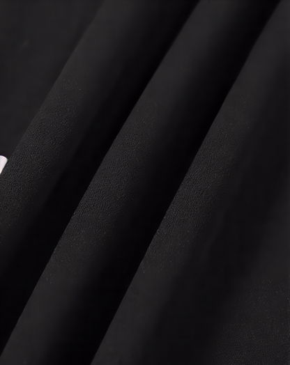 The Black Ruffle Cross Back Strap Maxi Dress